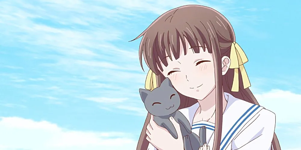Tohru Honda từ Fruits Basket với nụ cười ấm áp, biểu tượng của sự bao dung và quá trình chữa lành tâm hồn