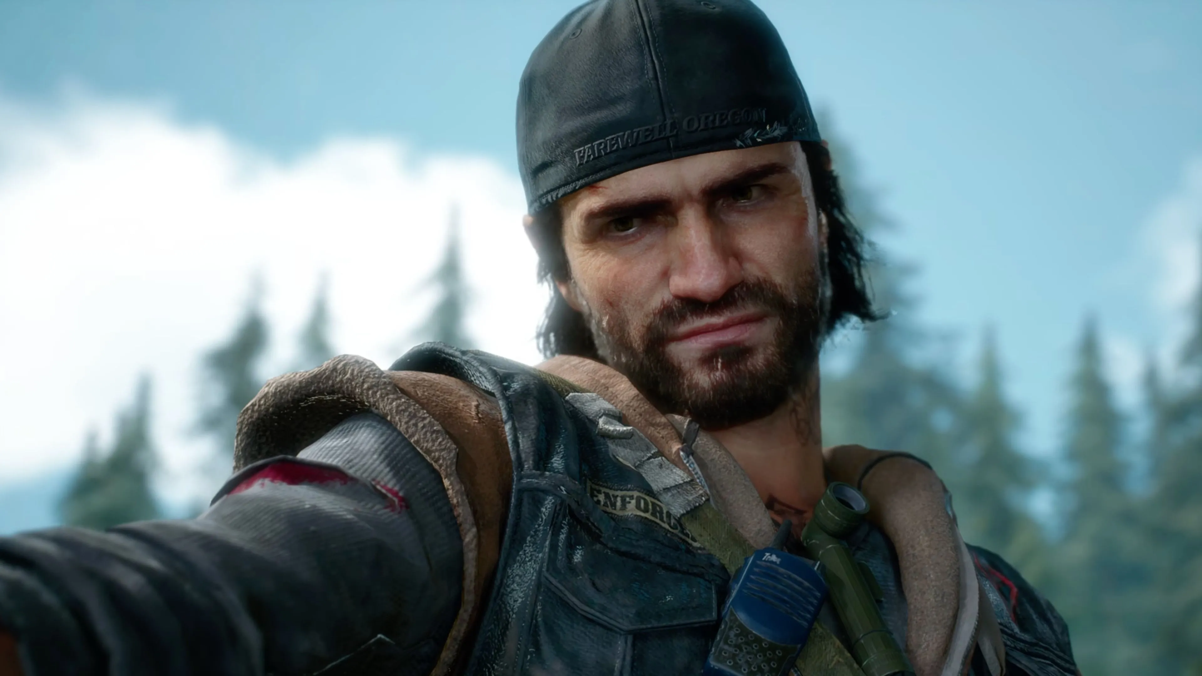 Deacon St. John đối đầu Freaker trong khung cảnh hoang tàn của Days Gone Remastered.