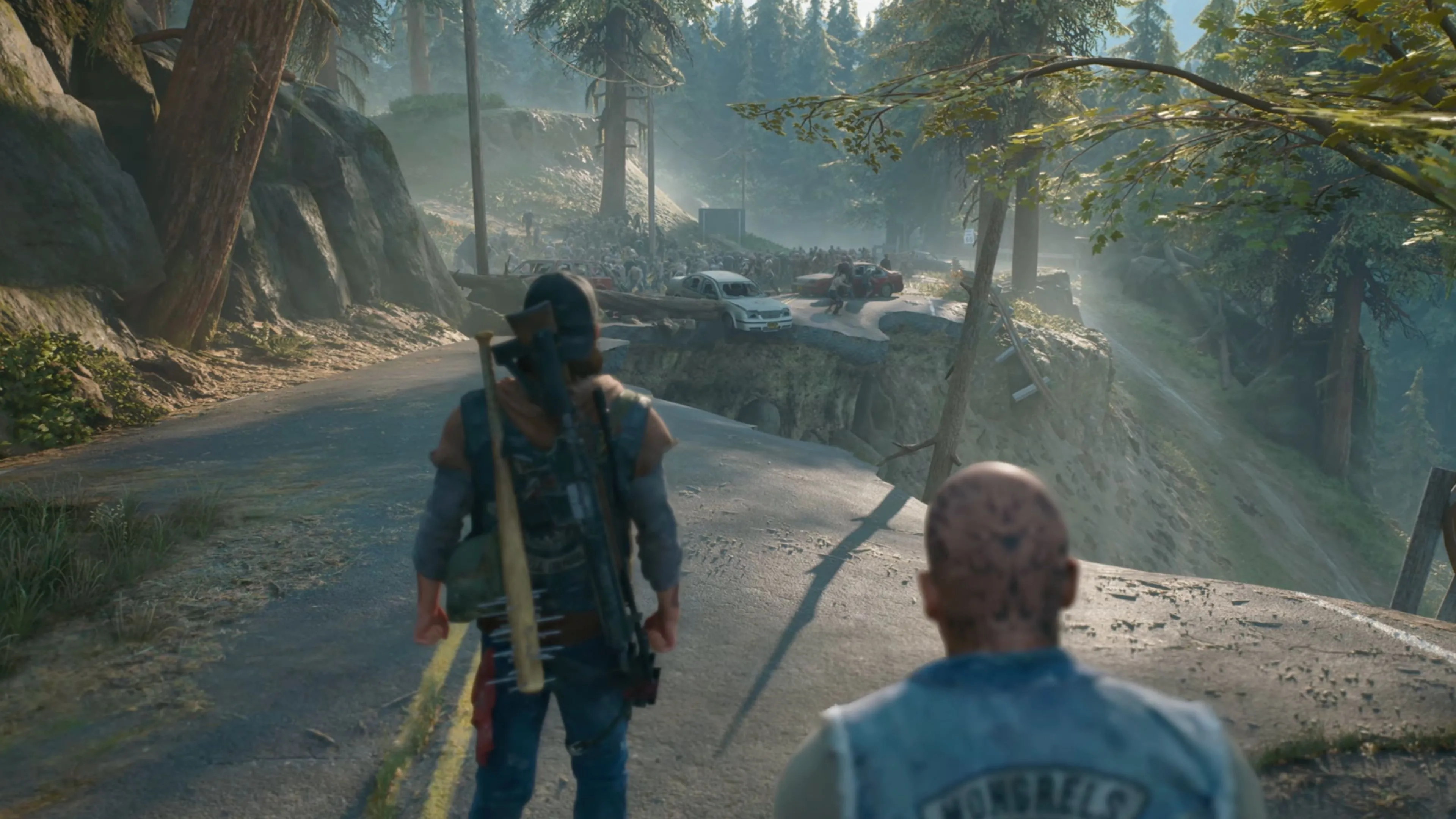Khung cảnh đổ nát và đầy rẫy nguy hiểm trong thế giới mở của Days Gone Remastered.