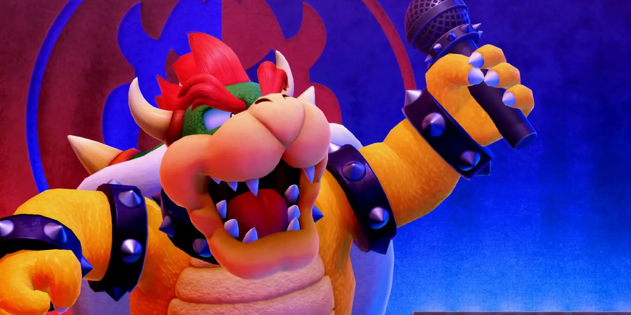 Bowser trên sân khấu với micro, hình ảnh phản chiếu hành vi bắt cóc và chiếm hữu trong tình yêu, một biểu tượng của sự thiếu vắng sự đồng thuận.